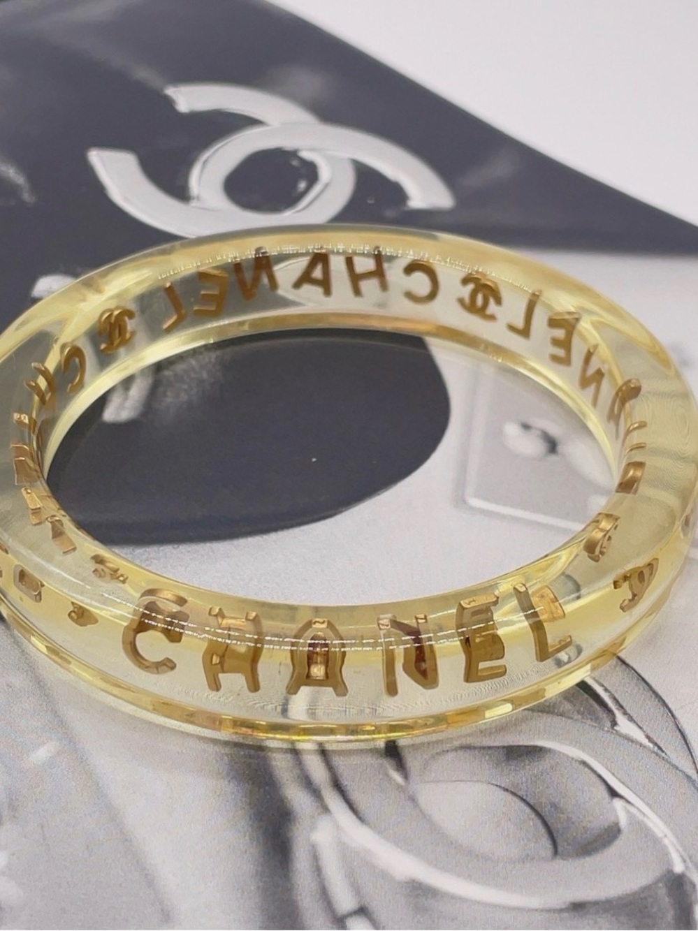 CHANEL LUCITE & Gold Letter Clear Acrylic Bangle - Picture 6 of 12